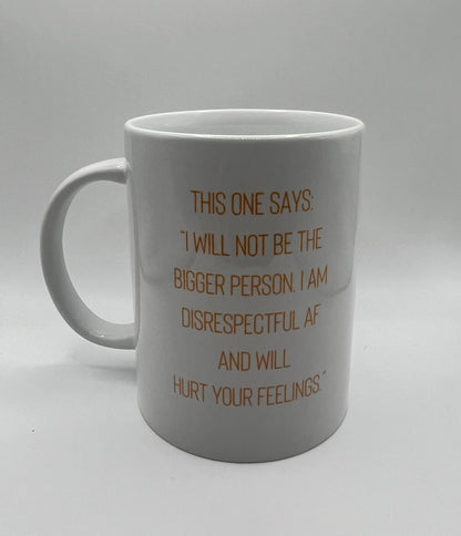 White mug with brown text on a gray background