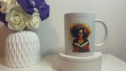 White mug with a portrait on a white surface with flowers in the background