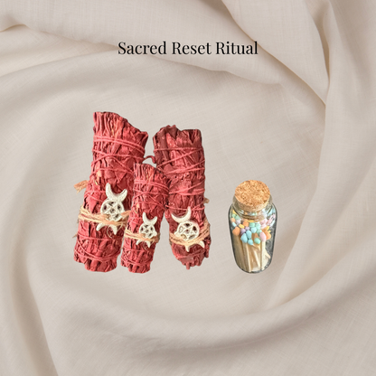 Two red smudge sticks with decorative elements on a beige fabric background, labeled 'Sacred Reset Ritual'.
